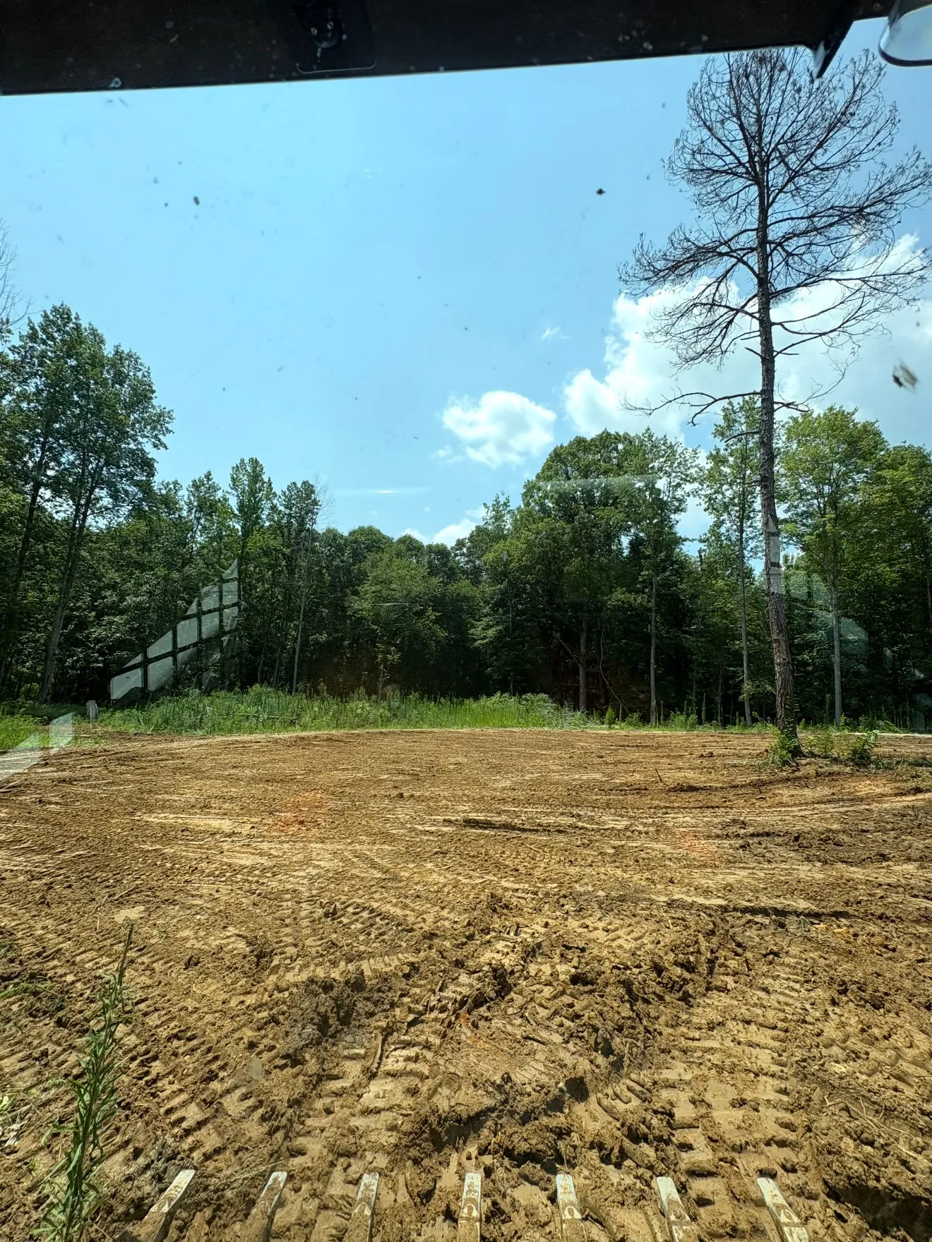 Freshly graded and levelled ground with drainage fall cut in