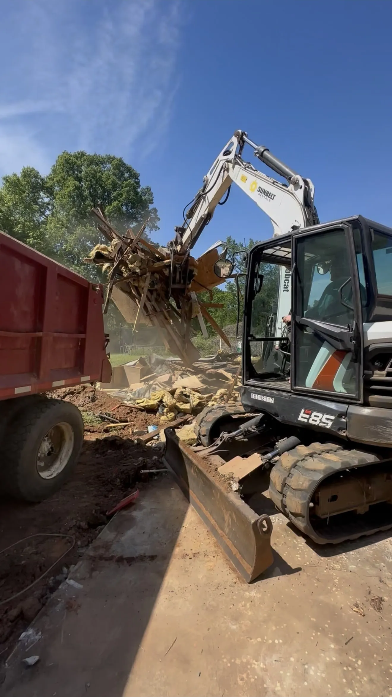 Cleared brush and debris loaded into a dump trailer